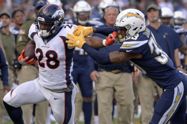 Royce Freeman runs with power against the Chargers. Credit: Jake Roth, USA TODAY Sports.