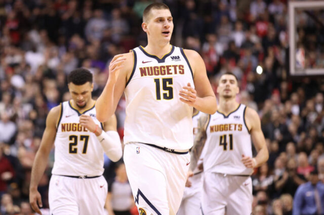 Denver Nuggets center Nikola Jokic (15) celebrates after scoring a basket late in the fourth quarter against the Toronto Raptors at Scotiabank Arena. The Nuggets beat the Raptors 106-103.