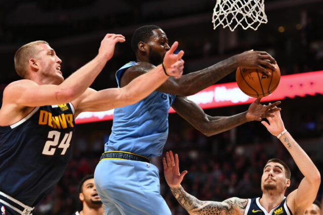 Dec 10, 2018; Denver, CO, USA; Memphis Grizzlies forward JaMychal Green (0) and Denver Nuggets forward Mason Plumlee (24) and forward Juan Hernangomez (41) go for a rebound in the second half at the Pepsi Center. Mandatory Credit: Ron Chenoy-USA TODAY Sports