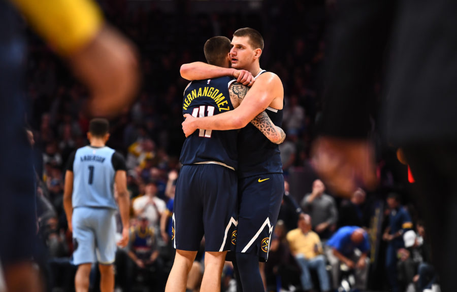 Denver Nuggets center Nikola Jokic (15) and forward Juan Hernangomez (41) celebrate the win over the Memphis Grizzlies at the Pepsi Center.