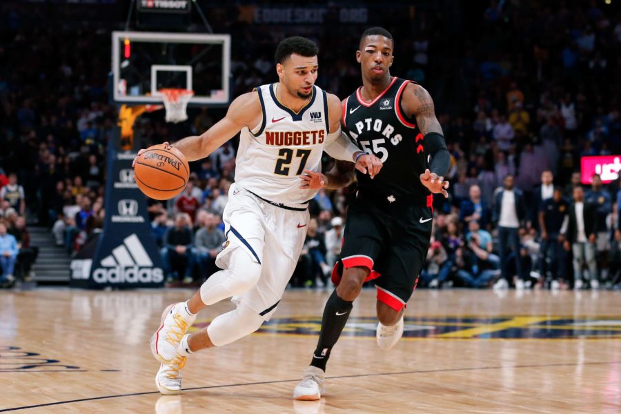 Toronto Raptors guard Delon Wright (55) guards Denver Nuggets guard Jamal Murray (27) in the fourth quarter at the Pepsi Center.