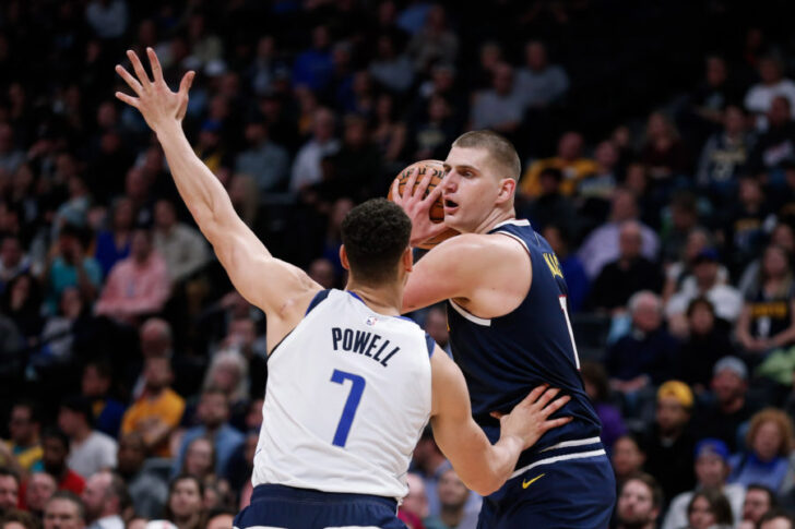 Dallas Mavericks forward Dwight Powell (7) guards Denver Nuggets center Nikola Jokic (15) in the second quarter at the Pepsi Center.