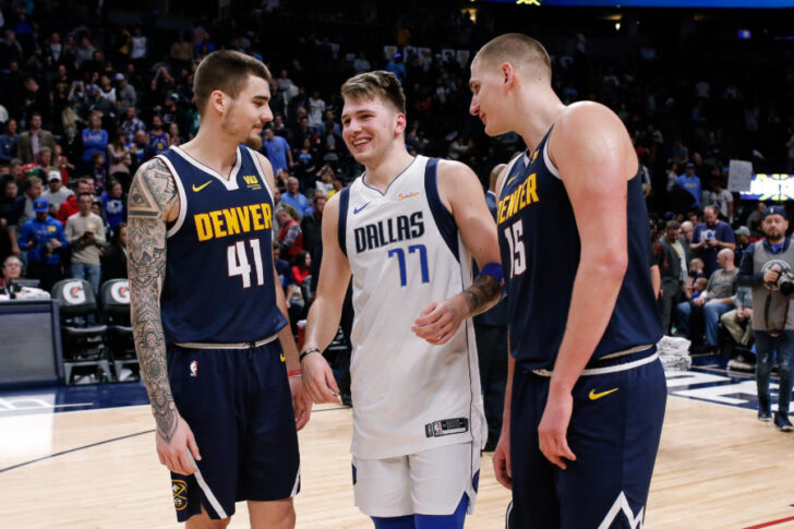 Dallas Mavericks forward Luka Doncic (77) visits with Denver Nuggets forward Juancho Hernangomez (41) and center Nikola Jokic (15) after the game at the Pepsi Center.