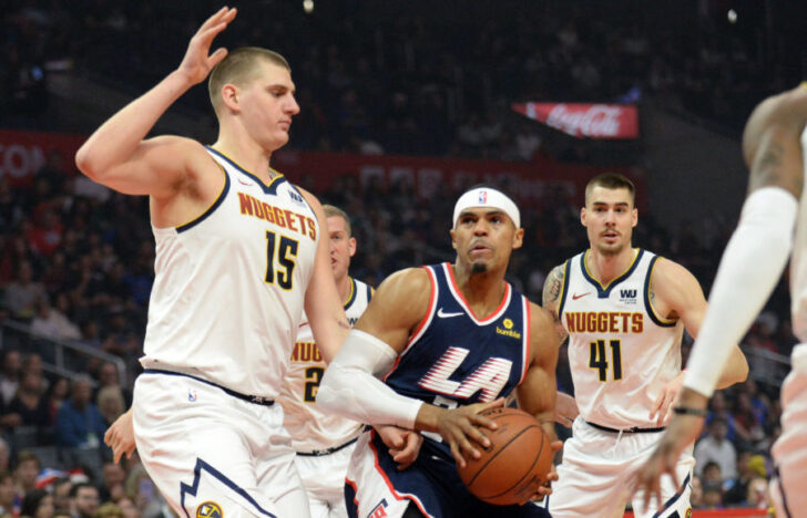 Los Angeles Clippers forward Tobias Harris (34) moves to the basket against Denver Nuggets center Nikola Jokic (15) during the first half at Staples Center.