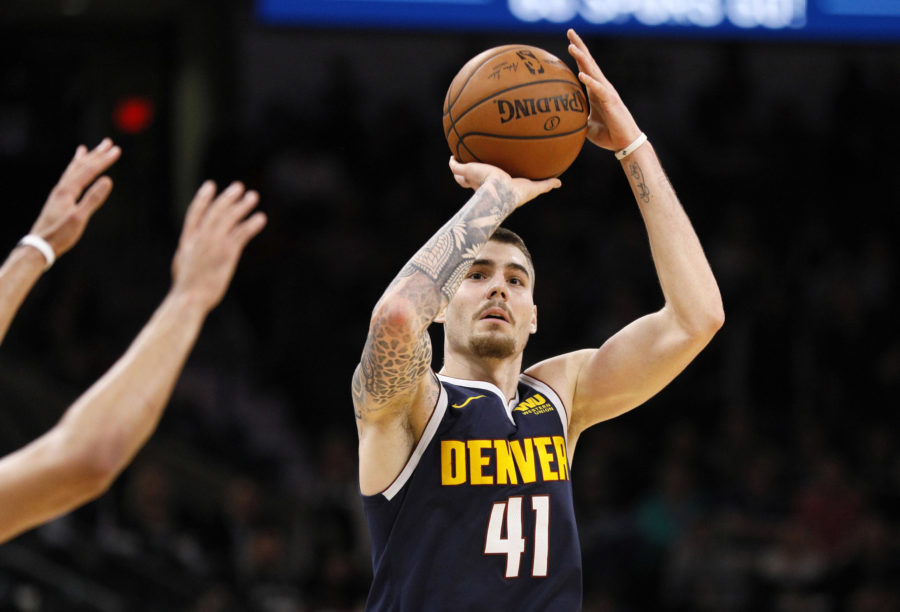 Denver Nuggets power forward Juan Hernangomez (41) shoots the ball over San Antonio Spurs point guard Derrick White (not pictured) during the second half at AT&T Center.