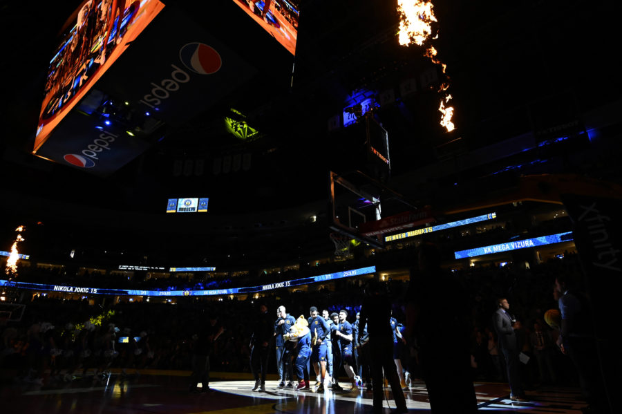 Denver Nuggets players huddle before the game against the San Antonio Spurs at Pepsi Center.