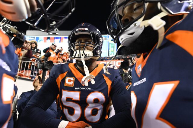 Von Miller and teammates. Credit: Ron Chenoy, USA TODAY Sports.