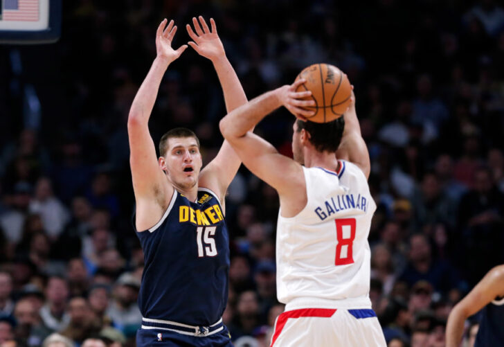 Denver Nuggets center Nikola Jokic (15) defends against Los Angeles Clippers forward Danilo Gallinari (8) in the second quarter at the Pepsi Center.