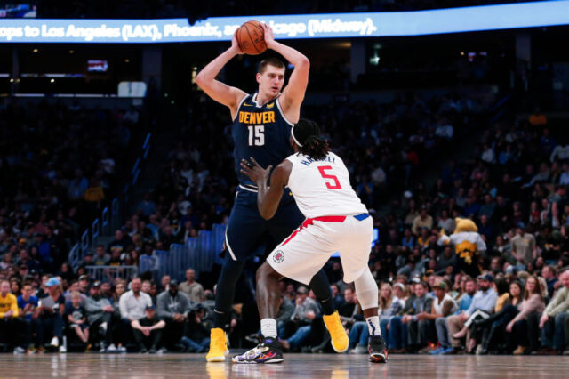 Los Angeles Clippers forward Montrezl Harrell (5) guards Denver Nuggets center Nikola Jokic (15) in the second quarter at the Pepsi Center.