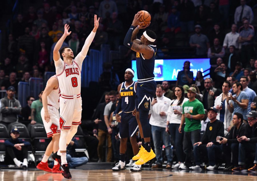 Denver, CO, USA; Denver Nuggets forward Torrey Craig (3) attempts a three point basket over Chicago Bulls guard Zach LaVine (8) in the first quarter of the game at the Pepsi Center.