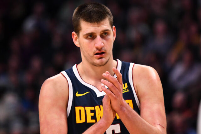 Denver Nuggets center Nikola Jokic (15) claps in the second half against the Chicago Bulls at the Pepsi Center.