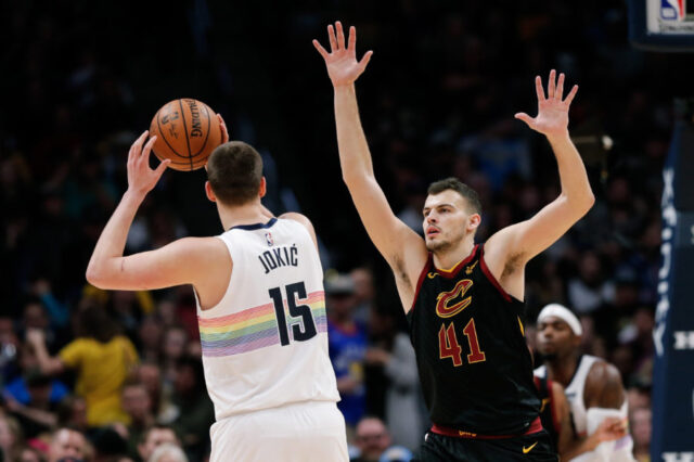 Cleveland Cavaliers center Ante Zizic (41) guards Denver Nuggets center Nikola Jokic (15) in the second quarter at the Pepsi Center.