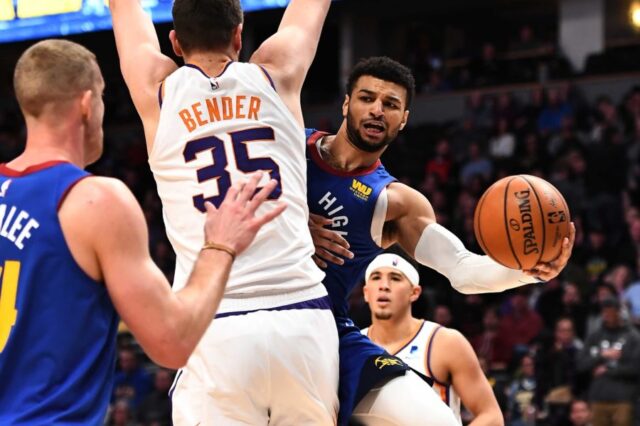 Denver Nuggets guard Jamal Murray (27) attempts a pass behind Phoenix Suns forward Dragan Bender (35) in the second quarter at the Pepsi Center.