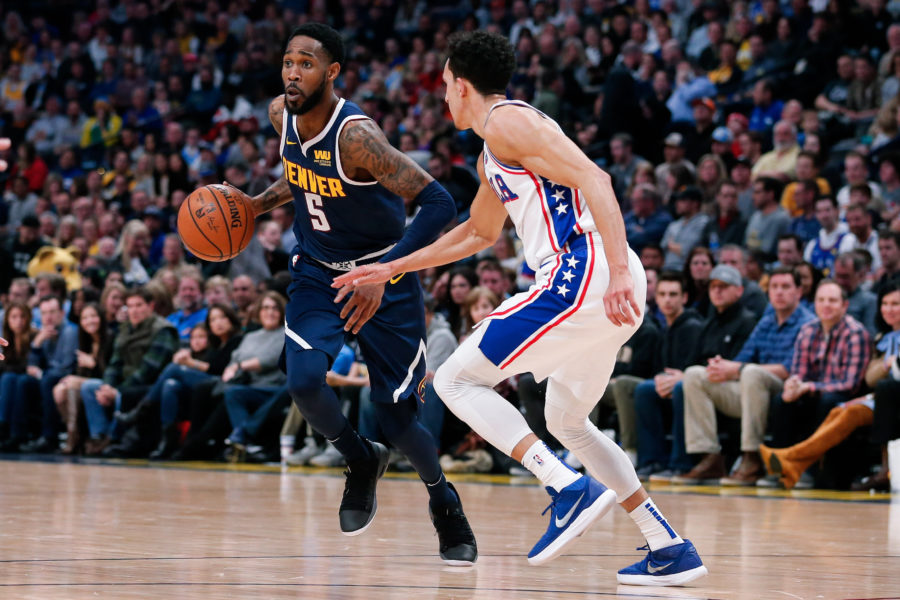 Denver Nuggets guard Will Barton (5) dribbles the ball against Philadelphia 76ers guard Landry Shamet (1) in the second quarter at the Pepsi Center.