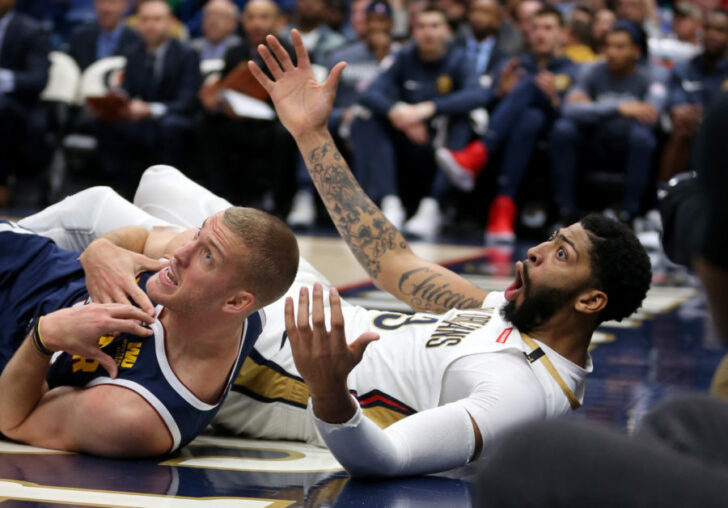 Denver Nuggets forward Mason Plumlee (24) and New Orleans Pelicans forward Anthony Davis (23) wait for a foul call in the second half at the Smoothie King Center. Davis was called for the foul.