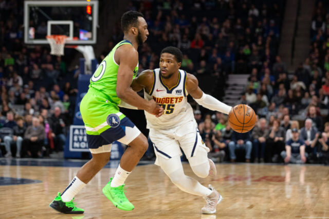 Denver Nuggets guard Malik Beasley (25) dribbles the ball as Minnesota Timberwolves guard Josh Okogie (20) guards him during the first quarter at Target Center.