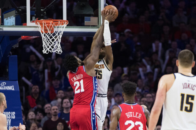 Philadelphia, PA, USA; Philadelphia 76ers center Joel Embiid (21) blocks the shot of Denver Nuggets guard Malik Beasley (25) during the fourth quarter at Wells Fargo Center.