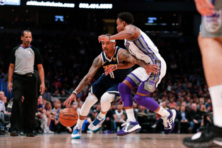 Sacramento Kings guard Yogi Ferrell (3) guards Denver Nuggets guard Isaiah Thomas (0) in the first quarter at the Pepsi Center.