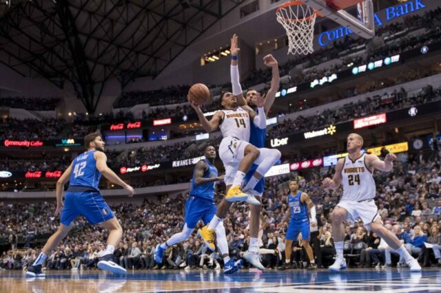 Denver Nuggets guard Gary Harris (14) drives to the basket past Dallas Mavericks forward Maximilian Kleber (42) and forward Dwight Powell (7) and forward Dorian Finney-Smith (10) during second half at the American Airlines Center.