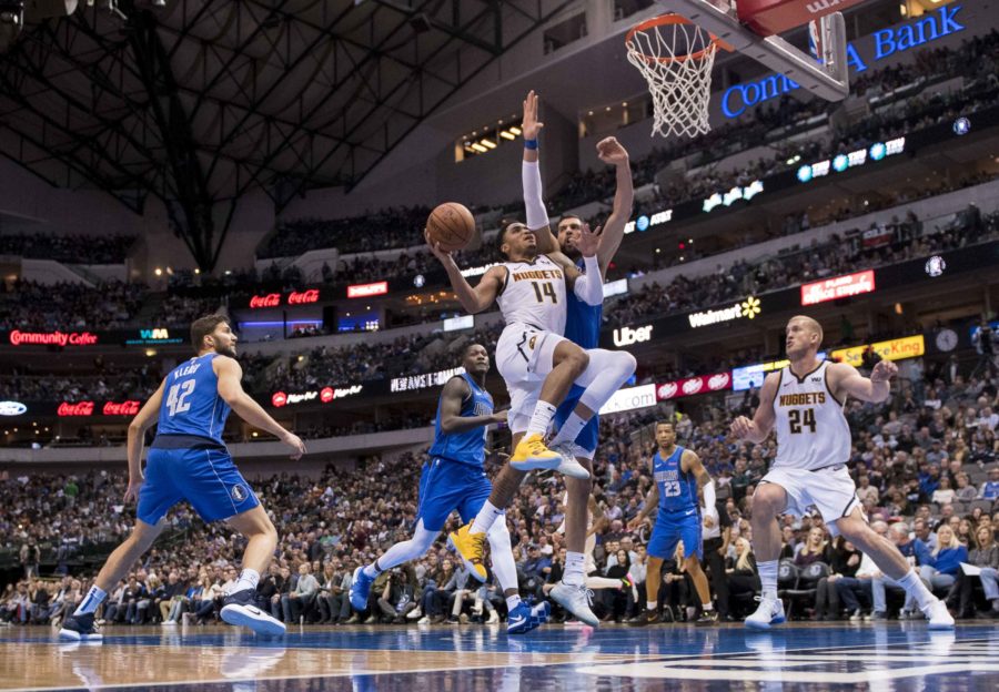 Denver Nuggets guard Gary Harris (14) drives to the basket past Dallas Mavericks forward Maximilian Kleber (42) and forward Dwight Powell (7) and forward Dorian Finney-Smith (10) during second half at the American Airlines Center.