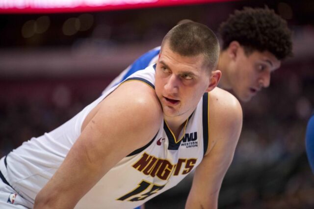 Denver Nuggets center Nikola Jokic (15) exchanges words with the Dallas Mavericks bench during second half at the American Airlines Center.