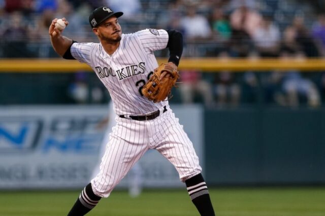 nolan arenado throws a ball