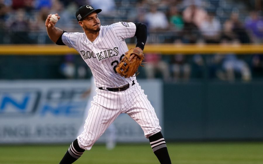 nolan arenado throws a ball