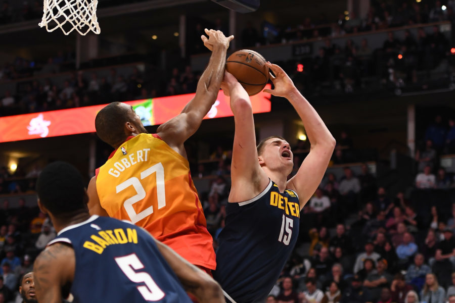 Denver Nuggets center Nikola Jokic (15) attempts a shot past Utah Jazz center Rudy Gobert (27) in the second half at the Pepsi Center.