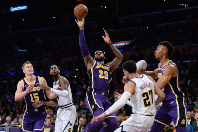 Los Angeles Lakers forward LeBron James (23) moves to the basket against Denver Nuggets guard Jamal Murray (27) during the second half at Staples Center.