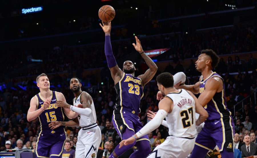 Los Angeles Lakers forward LeBron James (23) moves to the basket against Denver Nuggets guard Jamal Murray (27) during the second half at Staples Center.