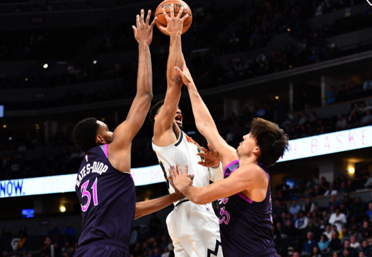 Minnesota Timberwolves forward Keita Bates-Diop (31) and forward Dario Saric (36) defend against Denver Nuggets guard Jamal Murray (27) in the first quarter at the Pepsi Center.