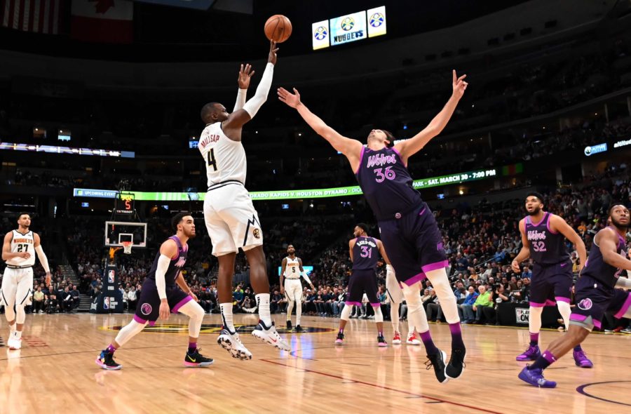 Denver Nuggets forward Paul Millsap (4) shoots over Minnesota Timberwolves forward Dario Saric (36) in the first quarter at the Pepsi Center.