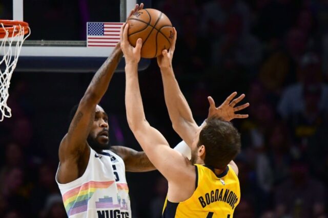 Denver Nuggets guard Will Barton (5) blocks a shot attempt by Indiana Pacers forward Bojan Bogdanovic (44) in the first quarter at the Pepsi Center.