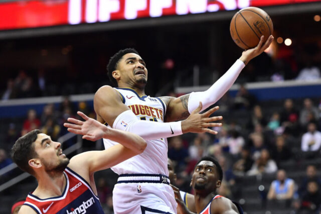 Denver Nuggets guard Gary Harris (14) shoots over Washington Wizards guard Tomas Satoransky (31) during the first half at Capital One Arena