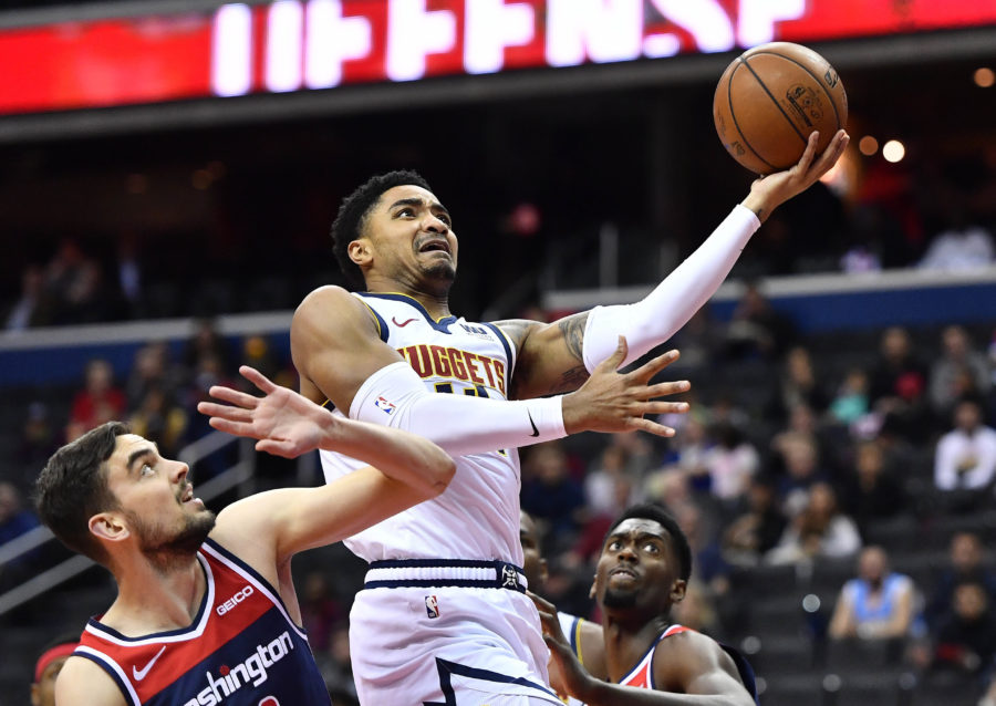 Denver Nuggets guard Gary Harris (14) shoots over Washington Wizards guard Tomas Satoransky (31) during the first half at Capital One Arena