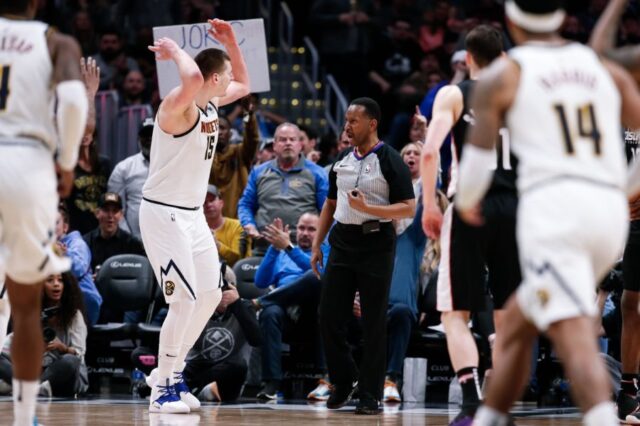 Denver Nuggets center Nikola Jokic (15) argues a call with referee James Capers (19) and is ejected on a double technical foul in the fourth quarter against the Washington Wizards at the Pepsi Center.