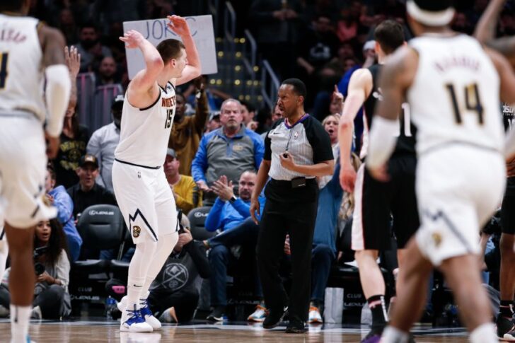 Denver Nuggets center Nikola Jokic (15) argues a call with referee James Capers (19) and is ejected on a double technical foul in the fourth quarter against the Washington Wizards at the Pepsi Center.