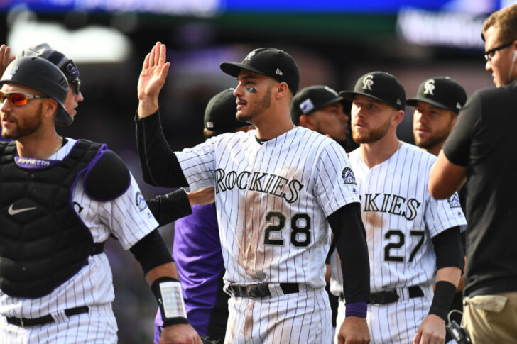 Colorado Rockies third baseman Nolan Arenado (28) celebrates after a win against the Washington Nationals at Coors Field.