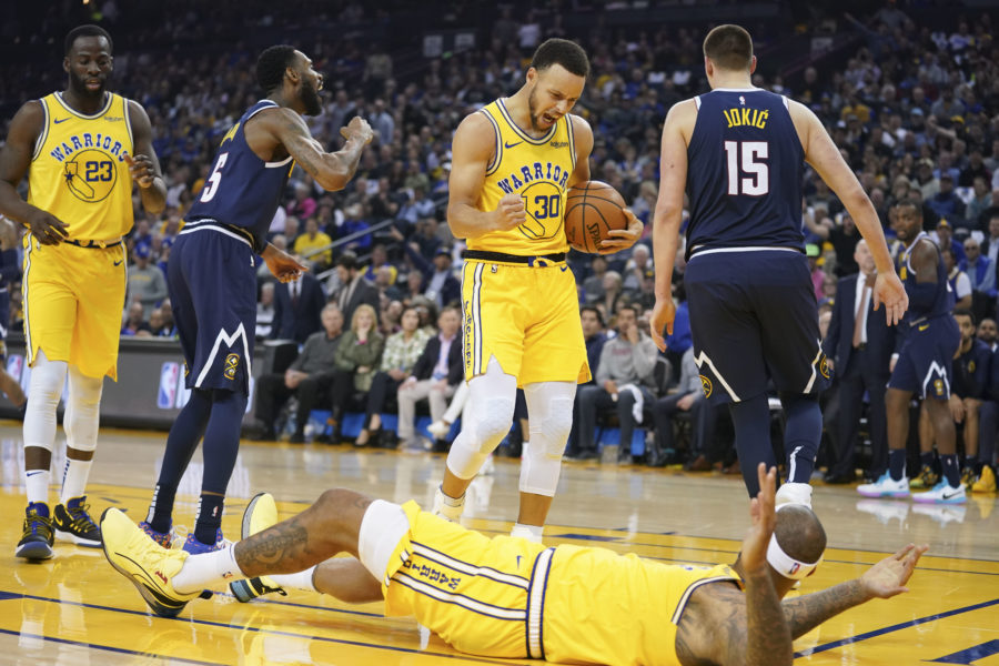 Golden State Warriors guard Stephen Curry (30) celebrates after a play against the Denver Nuggets during the first quarter at Oracle Arena.