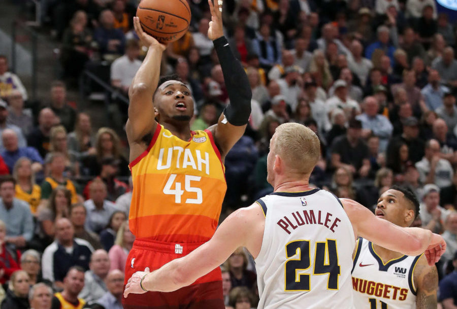 Utah Jazz guard Donovan Mitchell (45) shoots the ball over Denver Nuggets forward Mason Plumlee (24) during the fourth quarter at Vivint Smart Home Arena. Utah Jazz won 118-108.