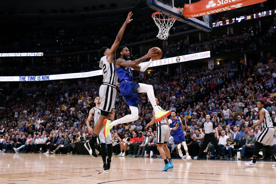 Denver Nuggets guard Will Barton (5) drives to the net against San Antonio Spurs forward Rudy Gay (22) in the second quarter at the Pepsi Center.