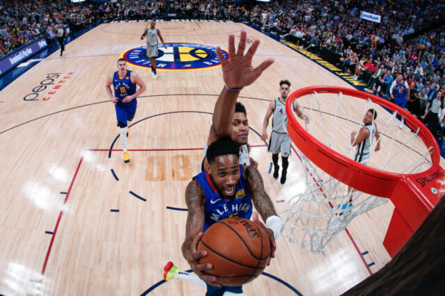 Denver Nuggets guard Will Barton (5) drives to the net ahead of San Antonio Spurs forward Rudy Gay (22) in the second quarter at the Pepsi Center. Mandatory Credit: