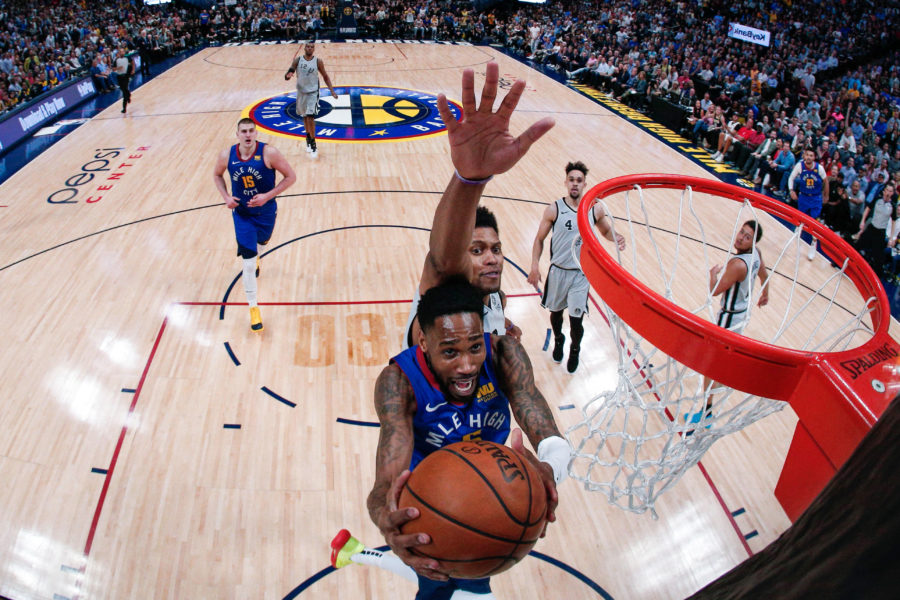 Denver Nuggets guard Will Barton (5) drives to the net ahead of San Antonio Spurs forward Rudy Gay (22) in the second quarter at the Pepsi Center. Mandatory Credit: