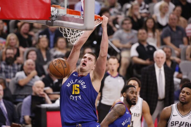 Denver Nuggets center Nikola Jokic (15) dunks the ball against the San Antonio Spurs in game six of the first round of the 2019 NBA Playoffs at AT&T Center.