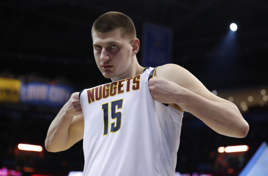 Denver Nuggets center Nikola Jokic (15) adjust his jersey during the second half against the Oklahoma City Thunder at Chesapeake Energy Arena. Denver won 115-105.