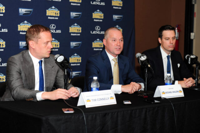 Denver Nuggets head coach Michael Malone (center) and general manager GM Tim Connelly (left) and president Josh Kroenke (right) during a press conference at the Pepsi Center.