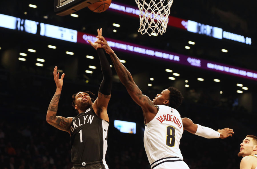 Brooklyn Nets guard D'Angelo Russell (1) shoots against Denver Nuggets forward Jarred Vanderbilt (8) during the second half at Barclays Center.