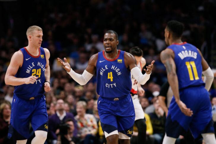 Denver Nuggets forward Paul Millsap (4) reacts after a play as forward Mason Plumlee (24) and guard Monte Morris (11) look on in the first quarter against the Portland Trail Blazers at the Pepsi Center.