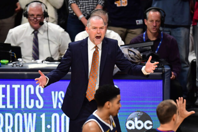 Denver Nuggets head coach Michael Malone reacts to a foul called in the fourth quarter against the San Antonio Spurs in game seven of the first round of the 2019 NBA Playoffs at the Pepsi Center.