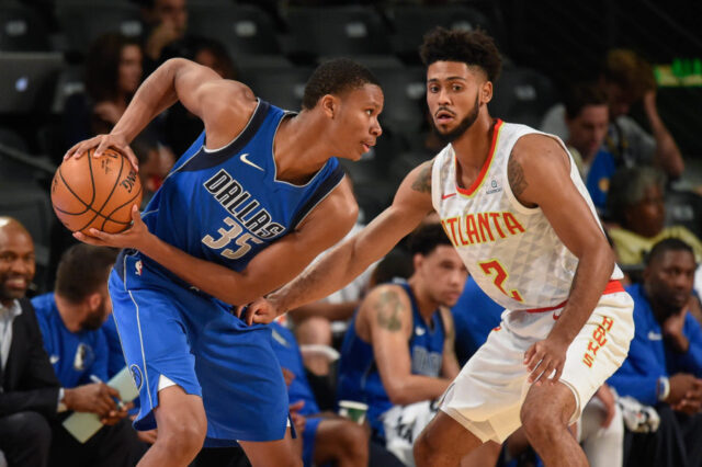 Dallas Mavericks guard PJ Dozier (35) is guarded by Atlanta Hawks guard Tyler Dorsey (2) during the first half at McCamish Pavilion.